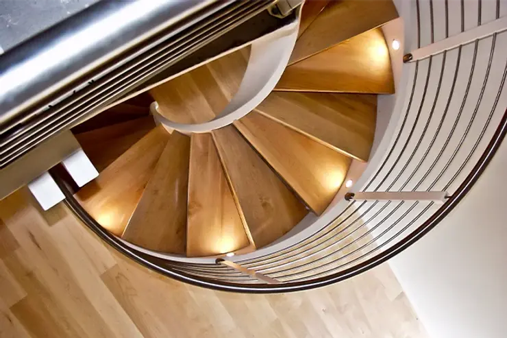 Birds eye view of a light wood spiral staircase