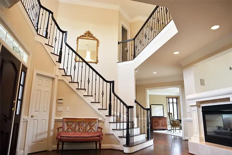 Custom wood stairs with black wood banister