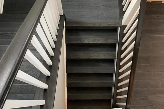 Black switchback wood staircase