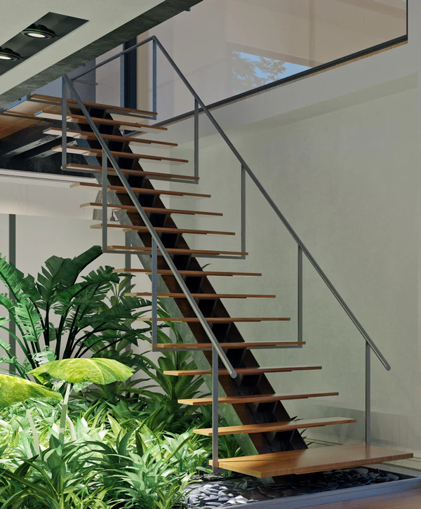 Modern floating stair design featuring wooden treads on a central metal stringer, suspended over a lush indoor garden with tropical plants and river stones in Alexandria, VA.