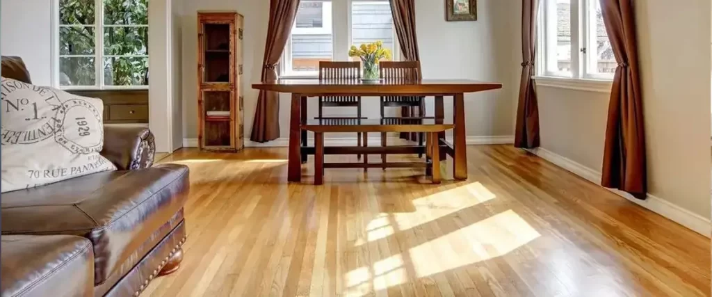 Best Type of Wood for Hardwood Floors: Picking the Right Species 2 Bright dining room with natural oak hardwood flooring and warm residential interior design