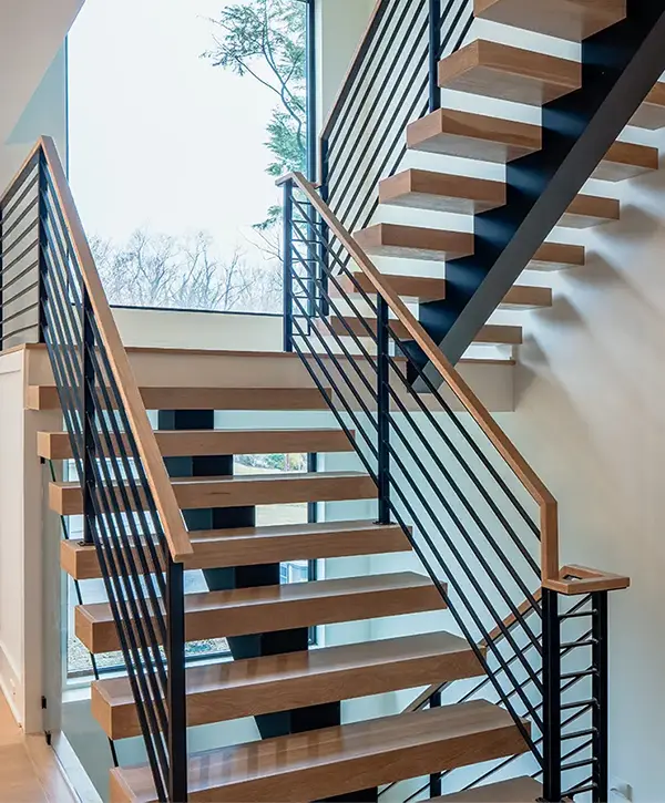 Stair Design in McLean, VA 1 Custom open-riser staircase with wood treads and modern black cable railing system