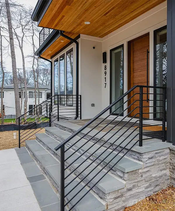 Stair Railing Installation in Springfield, VA 1 Modern exterior stair railing with black metal horizontal bars on contemporary home entrance